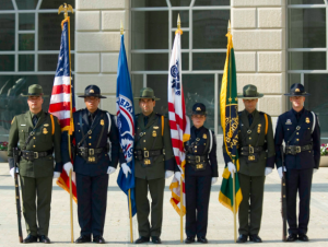 Trademark green uniforms worn by Border Patrol agents. 