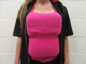 The 21-year-old woman tried to hide cocaine by taping it to her chest and stomach, via Border Patrol. 