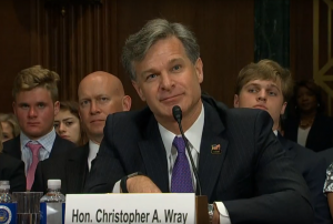 Christopher Wray testifies during his confirmation hearing to become the next FBI director. 