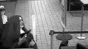 Two bank robbers dressed as nuns. 