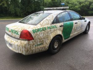 Border Patrol car covered in liquid manure. Photo via CBP. 