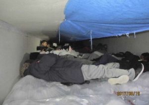 About 60 immigrants were found in this frigid trailer. Photo via CBP. 